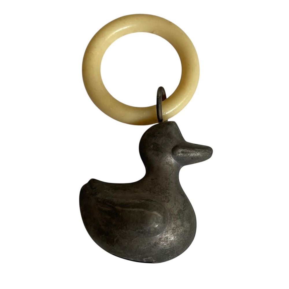 Vintage metal duck baby rattle toy collectible